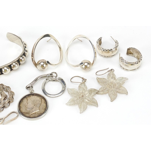 1105 - Silver jewellery including Mexican bangle, filigree earrings and a love heart bracelet, 109.0g