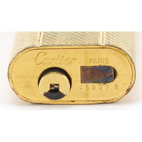 441 - Cartier gold plated pocket lighter, 7cm high