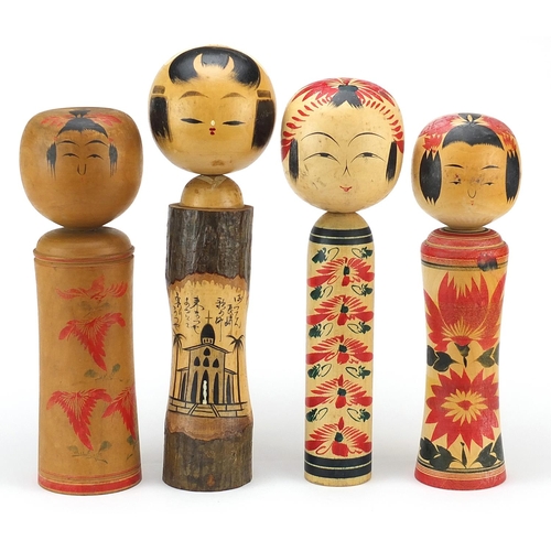 450 - Four Japanese Kokeshi dolls, the largest 36cm high