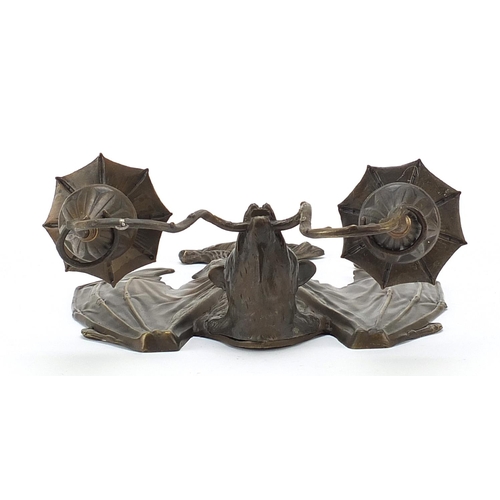 225 - Art Nouveau style patinated bronze bat design two branch wall sconce, 35cm high