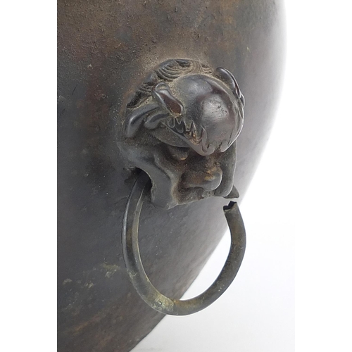 449 - Chinese patinated bronze censer with dog of Foo head and ring handles, 13.5cm high