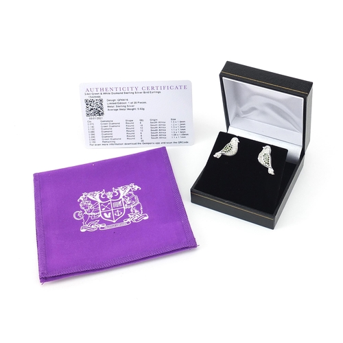 1093 - Pair of sterling silver green and white diamond bird earrings with certificate, approximately 0.75 c... 