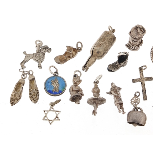 1080 - Nineteen silver charms including bottle of rum, post box and sombrero hat, the largest 2.8cm in diam... 