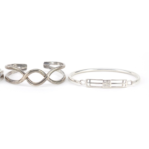 1085 - Four silver bangles including one Rennie Macintosh design, 56.7g