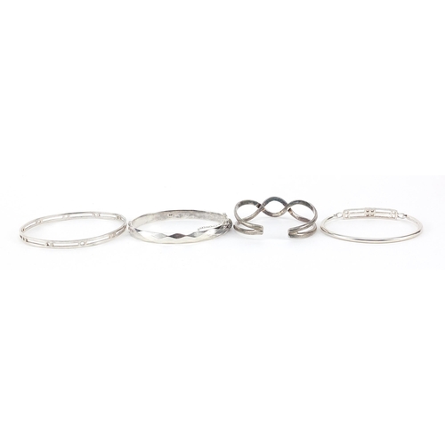 1085 - Four silver bangles including one Rennie Macintosh design, 56.7g