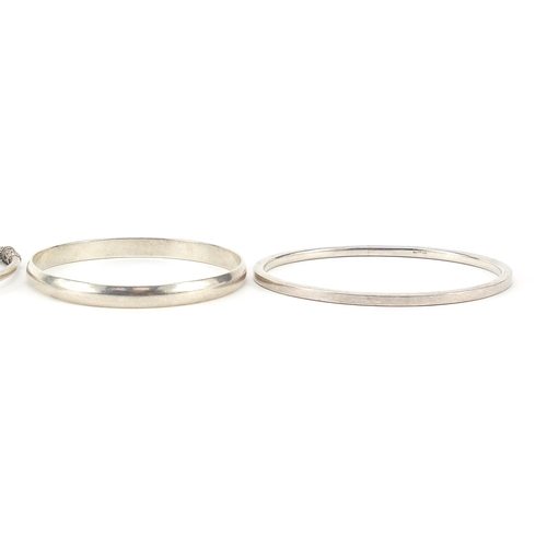 1054 - Four silver bangles, 67.6g