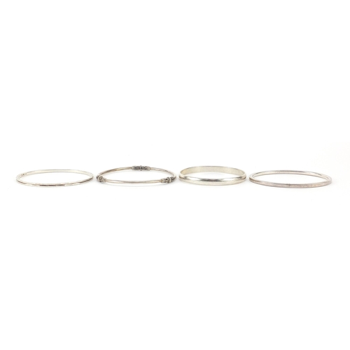 1054 - Four silver bangles, 67.6g