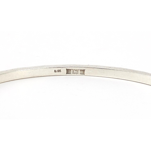 1054 - Four silver bangles, 67.6g