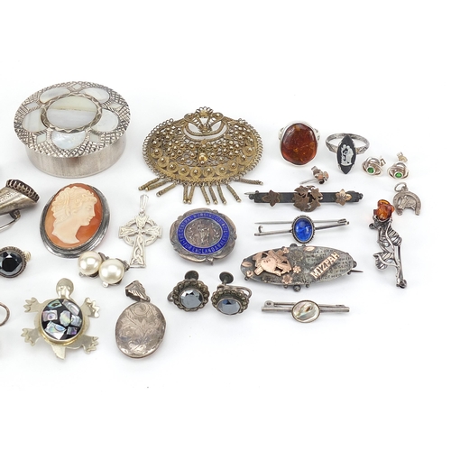 1100 - Antique and later jewellery and objects including a silver and enamel spoon, two rabbit's foot brooc... 