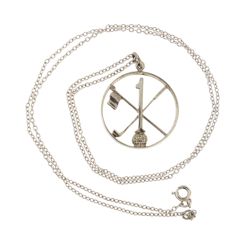 1065 - Silver golfing interest no 1 pendant on a silver coloured metal necklace, the pendant 2.8cm in diame... 