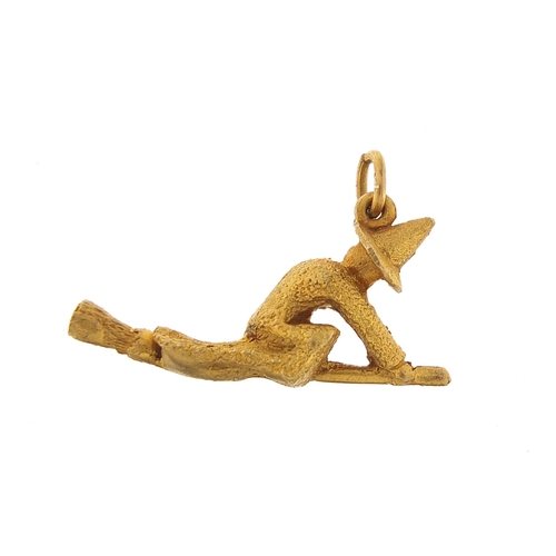 759 - 9ct gold witch on a broomstick charm, 2.4cm in length, 3.2g