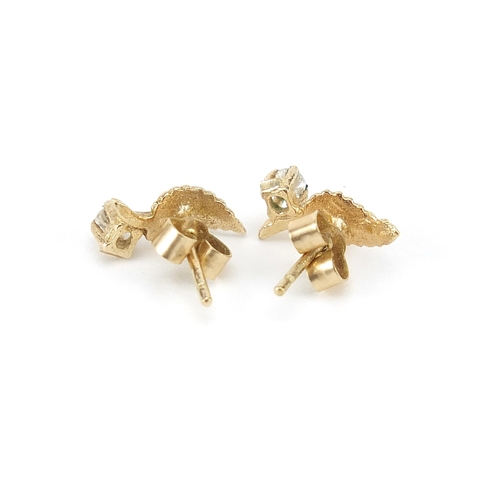 1096 - Pair of 9ct gold cubic zirconia leaf stud earrings, 1cm high, 0.7g