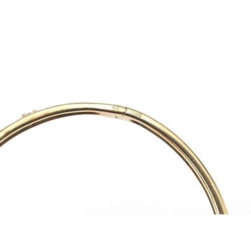 787 - 9ct gold diamond hinged bangle, 6.5cm wide, 11.9g