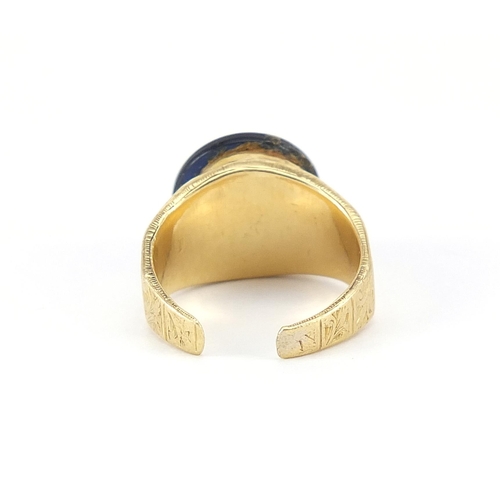 760 - Antique unmarked gold cabochon blue stone ring, the band with engraved decoration, (tests as 15ct+ g... 