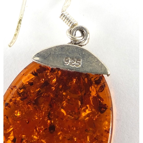 1163 - Two pairs of silver and amber earrings and pendant on chain, 23.0g