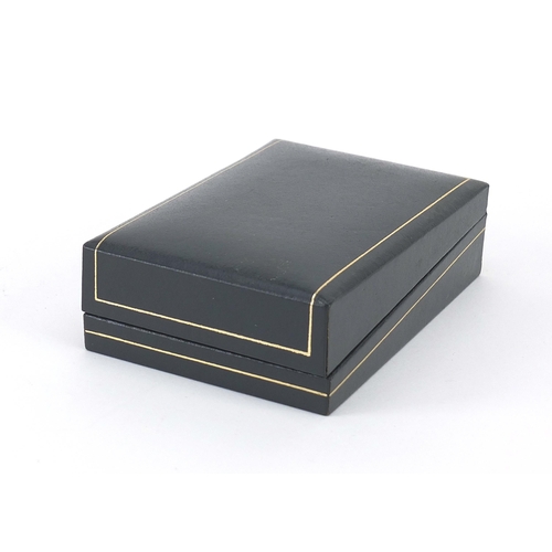 1074 - Dunhill, pair of gold plated cufflinks and tie clip with fitted box, the tie clip 5.2cm in length