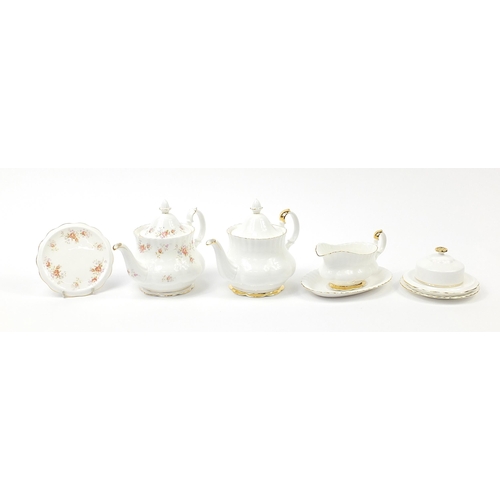 509 - Royal Albert teaware including Peach Rose and Val D'or teapots, each teapot 25cm in length