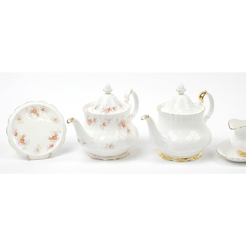 509 - Royal Albert teaware including Peach Rose and Val D'or teapots, each teapot 25cm in length