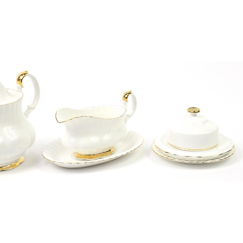 509 - Royal Albert teaware including Peach Rose and Val D'or teapots, each teapot 25cm in length