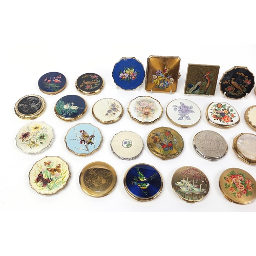 131 - Thirty vintage ladies compacts, some with cases including Stratton