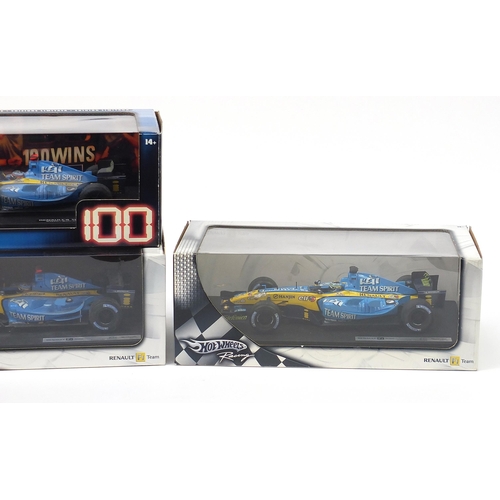 726 - Four Hot Wheels racing 1/18 scale F1 vehicles with boxes including Fernando Alonso