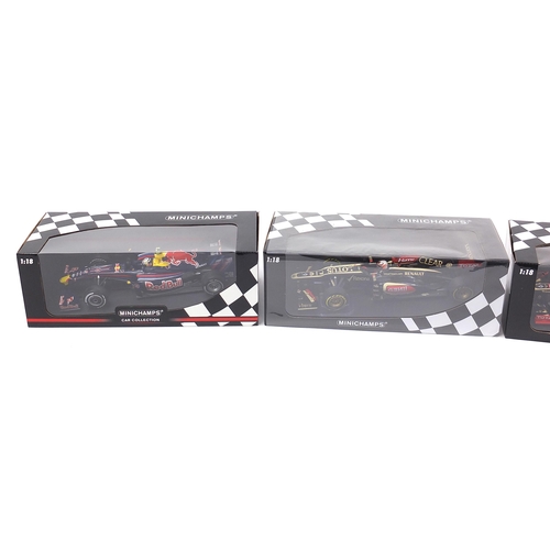 725 - Three Minichamps 1/18 scale diecast F1 vehicles comprising Roman Grosjean 2012, Kimi Raikkonen 2013 ... 