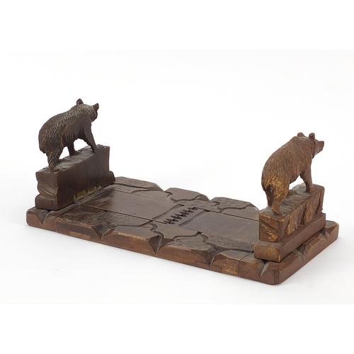 191 - Black Forest extending book slide carved with two bears, 27.5cm wide when closed