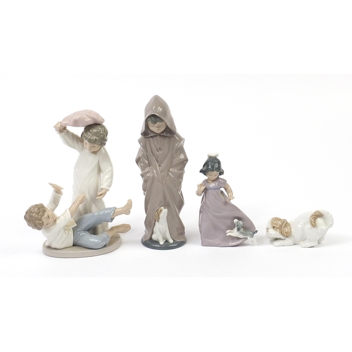 504 - Nao collectable china including a figure group of two children having a pillow fight and a dog, the ... 