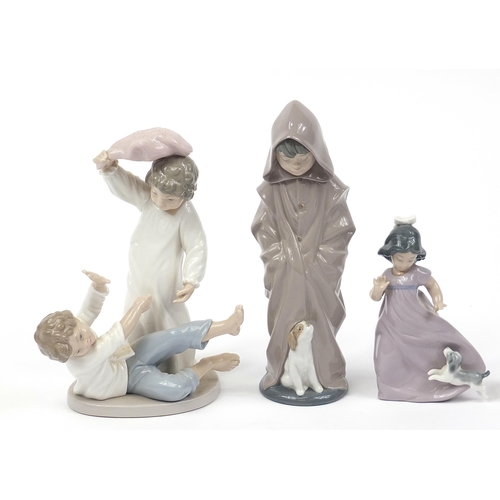 504 - Nao collectable china including a figure group of two children having a pillow fight and a dog, the ... 