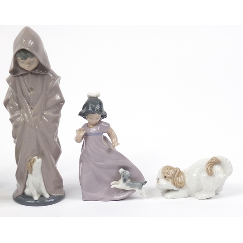 504 - Nao collectable china including a figure group of two children having a pillow fight and a dog, the ... 