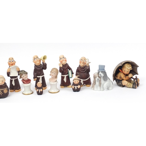 1326 - Collectable china including Goebel monks and a Nao dog group numbered 1480, the largest 15cm high