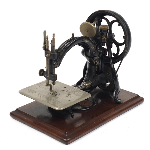 375 - Willcox & Gibbs hand operated sewing machine with case, the case 35.5cm in length