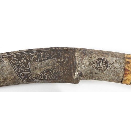 154 - Afghan pesh-kabz knife with bone handle, sheath and steel blade engraved with wild animal amongst fo... 