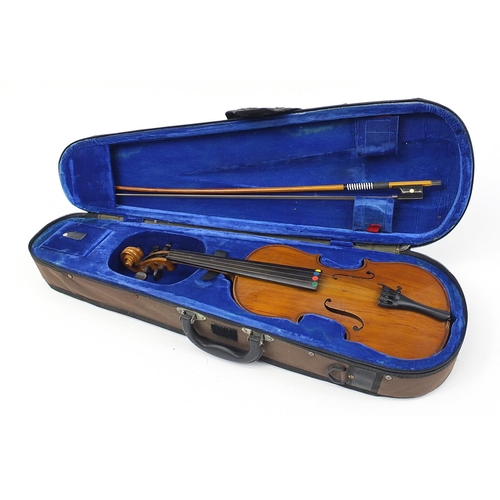 711 - Wooden violin with bow and protective carry case, the violin bearing a paper label The Buckingham Vi... 