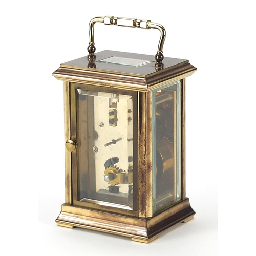 390 - St James brass cased carriage clock with enamelled dial, bevelled glass and swing handle, 12.5cm hig... 