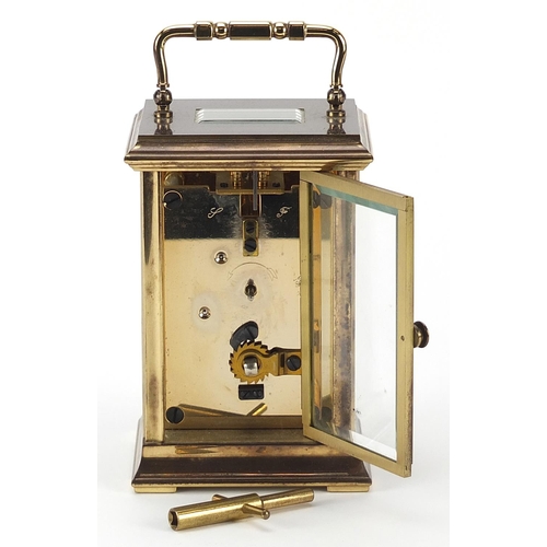 390 - St James brass cased carriage clock with enamelled dial, bevelled glass and swing handle, 12.5cm hig... 