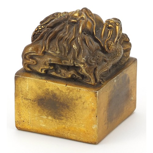 1209 - Large Chinese patinated bronze dragon seal paperweight, character marks to the base, 9.5cm high