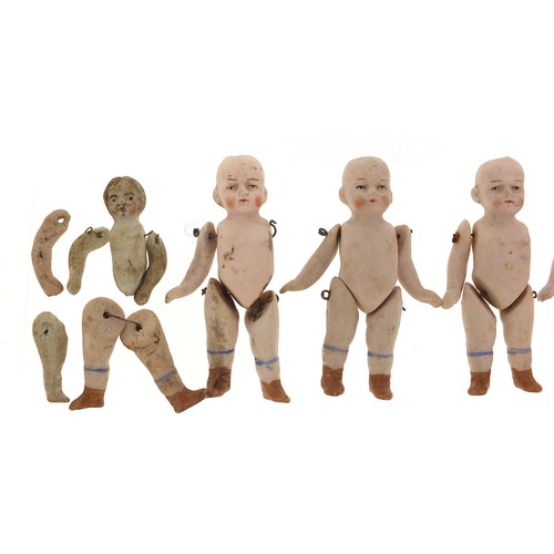 735 - Six miniature German bisque dolls with jointed limbs, each 7cm high