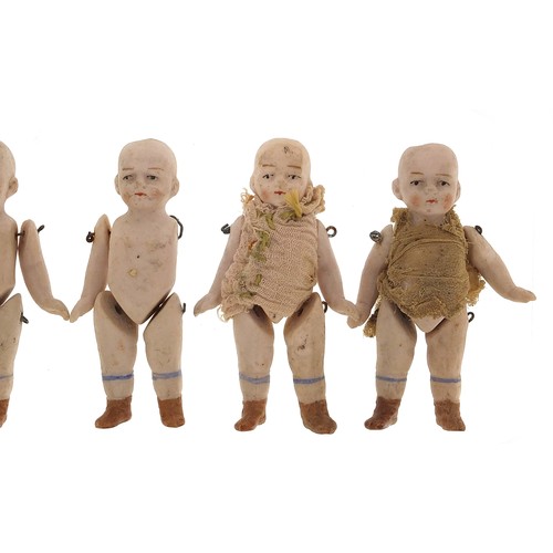 735 - Six miniature German bisque dolls with jointed limbs, each 7cm high