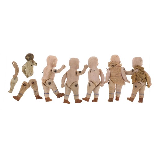 735 - Six miniature German bisque dolls with jointed limbs, each 7cm high