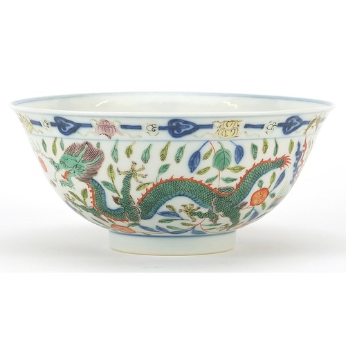 89 - Chinese doucai porcelain bowl finely hand painted with phoenixes and dragons amongst flowers, six fi... 