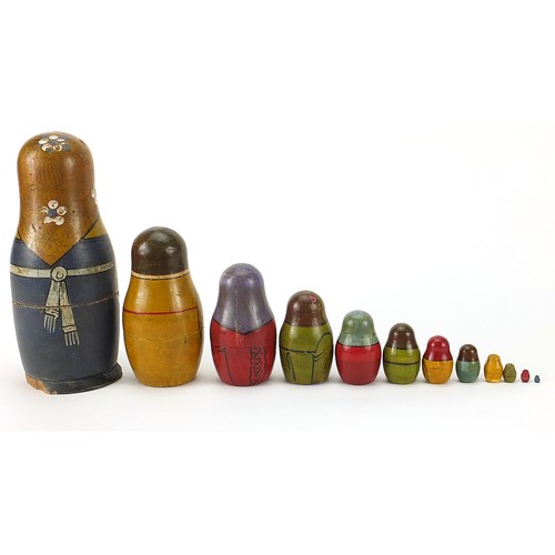 257 - Early Russian Matryoshka hand painted stacking dolls comprising twelve inter-fitting dolls, the larg... 