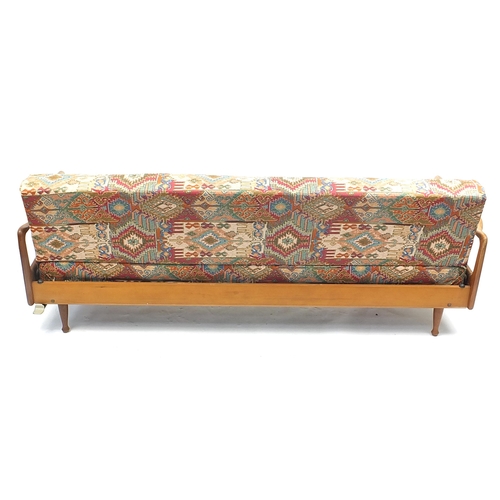 641 - Mid century Scandinavian teak sofa bed with geometric upholstery, 205cm wide