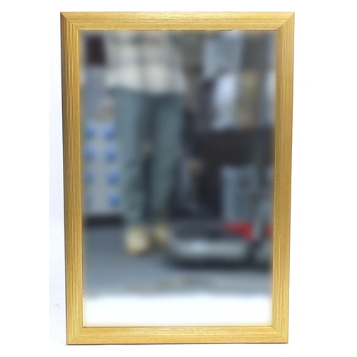 687 - Rectangular gilt framed wall mirror with bevelled glass, 96cm x 64cm