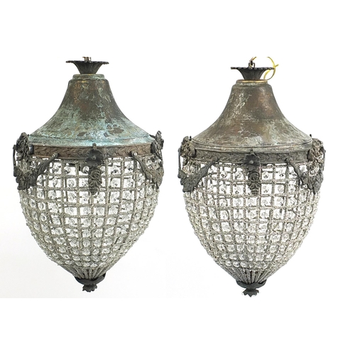 691 - Pair of ornate bronzed metal chandeliers, 50cm high