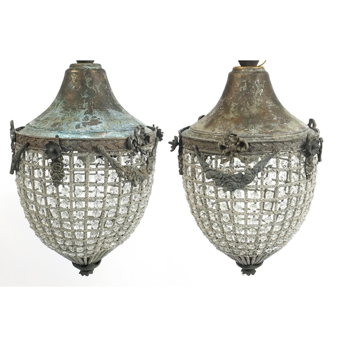 691 - Pair of ornate bronzed metal chandeliers, 50cm high