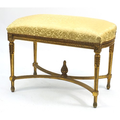 665 - Large French design gilt stool with gold floral upholstery, 68cm H x 93cm W x 50cm D