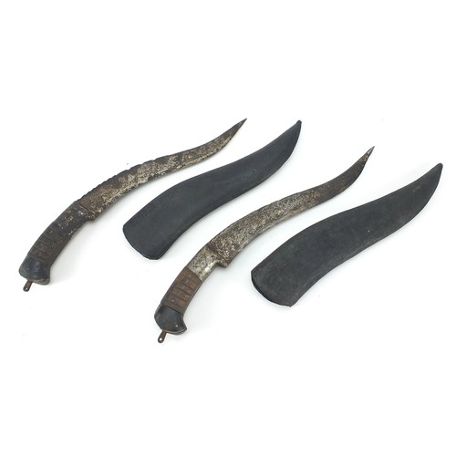 153 - Two Afghan pesh-kabz knives with sheaths and engraved steel blades, 40cm and 38cm in length