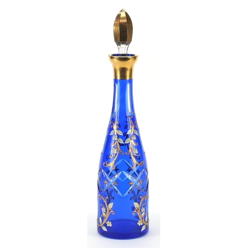 104 - Attributed to Moser, Bohemian blue overlaid glass decanter enamelled with flowers, 40cm high