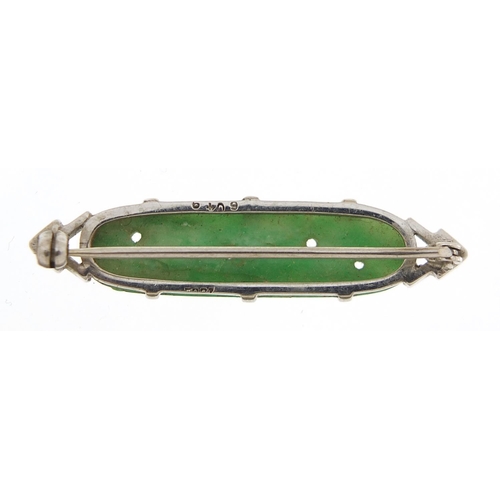 910 - 18ct white gold and Chinese carved green jade brooch, 4cm wide, 5.4g